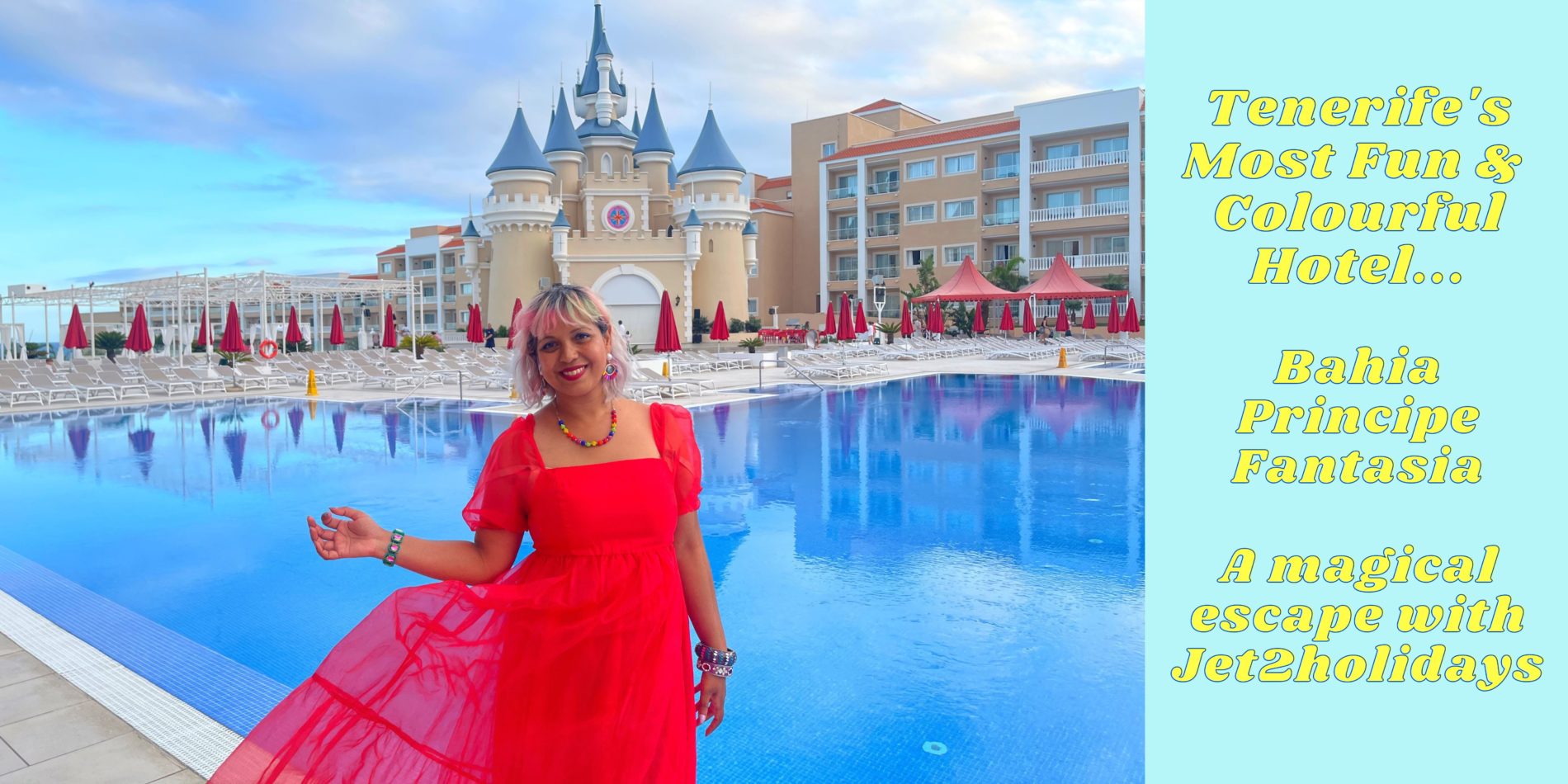 girl in red dress standing infront of pool infront of castle at hotel