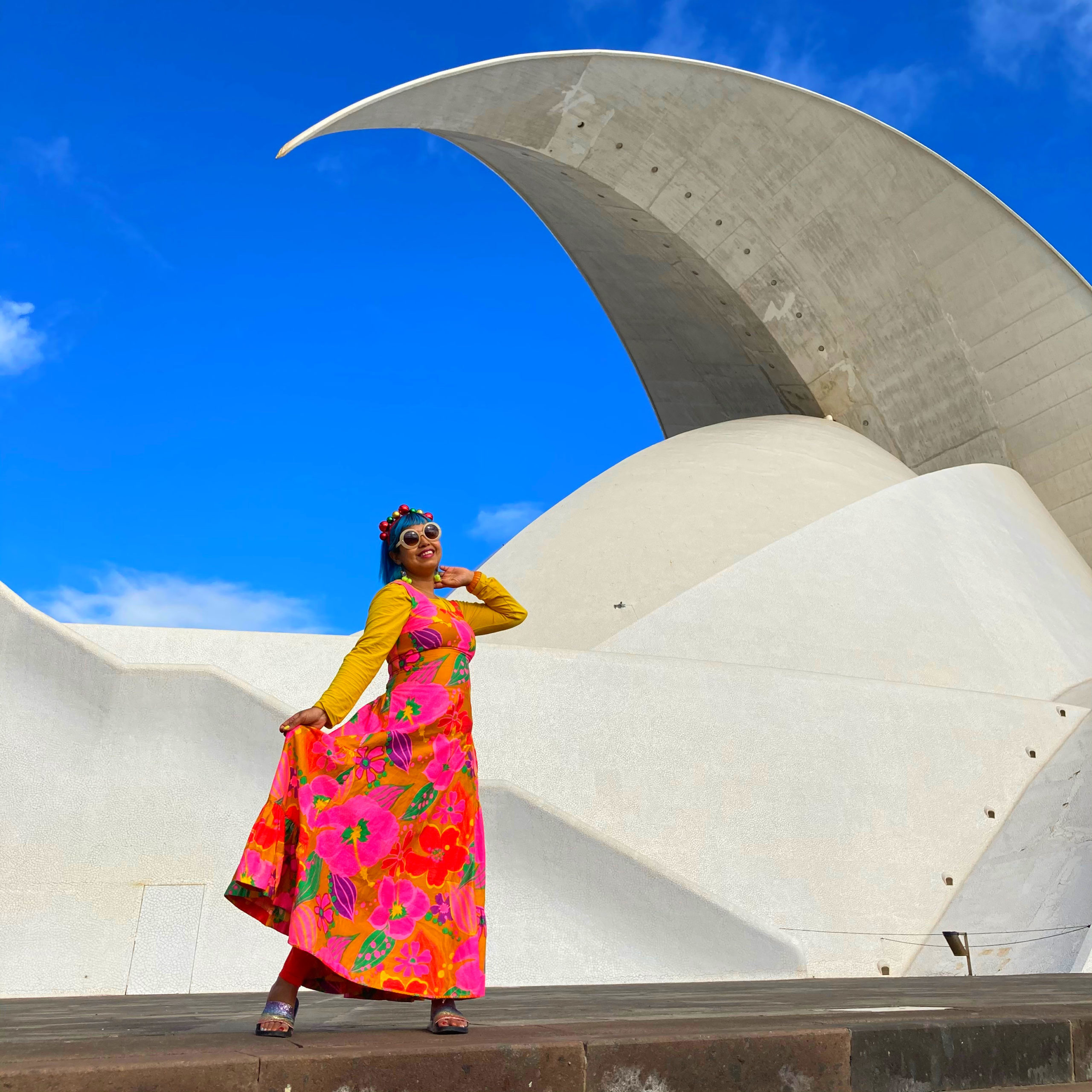 Curvy white architecture girl in colourful dress