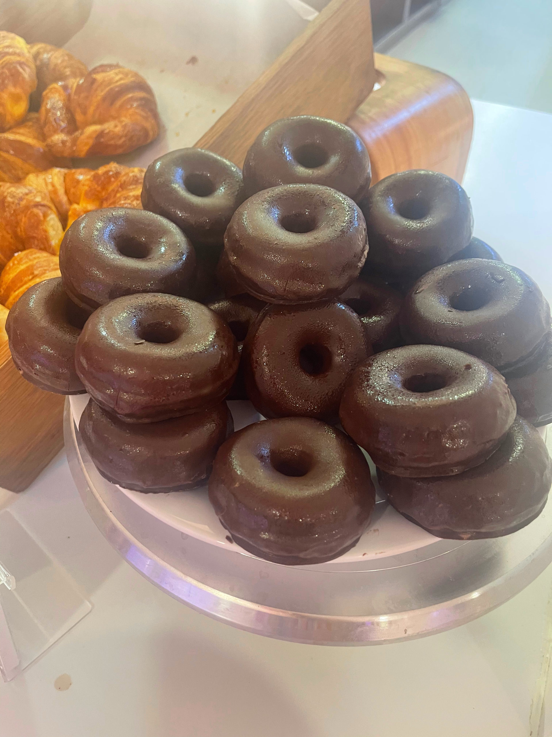 Large platter of chocolate covered doughnuts