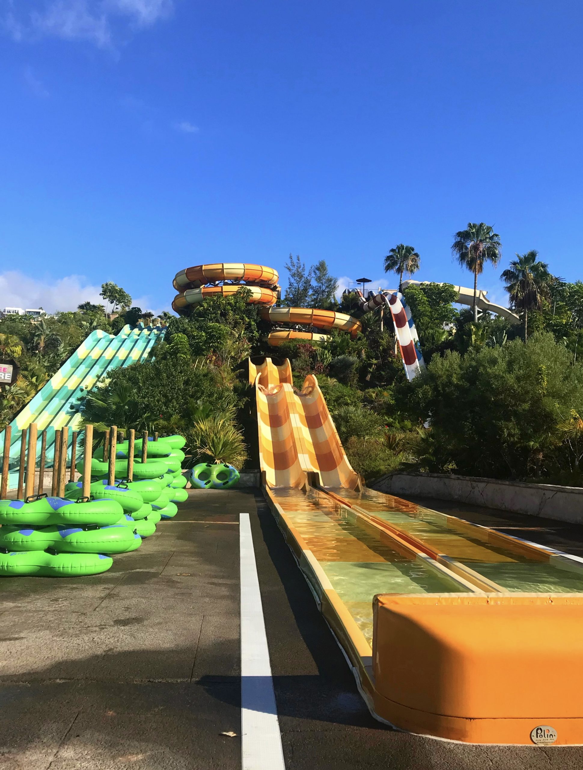 Colourful stripey waterslides at waterpark