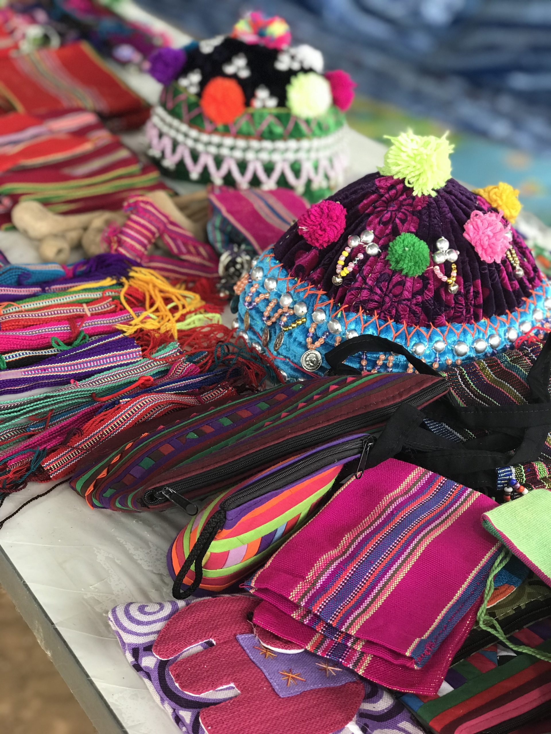 selection of colourful handmade crafts at a market stall in thailans