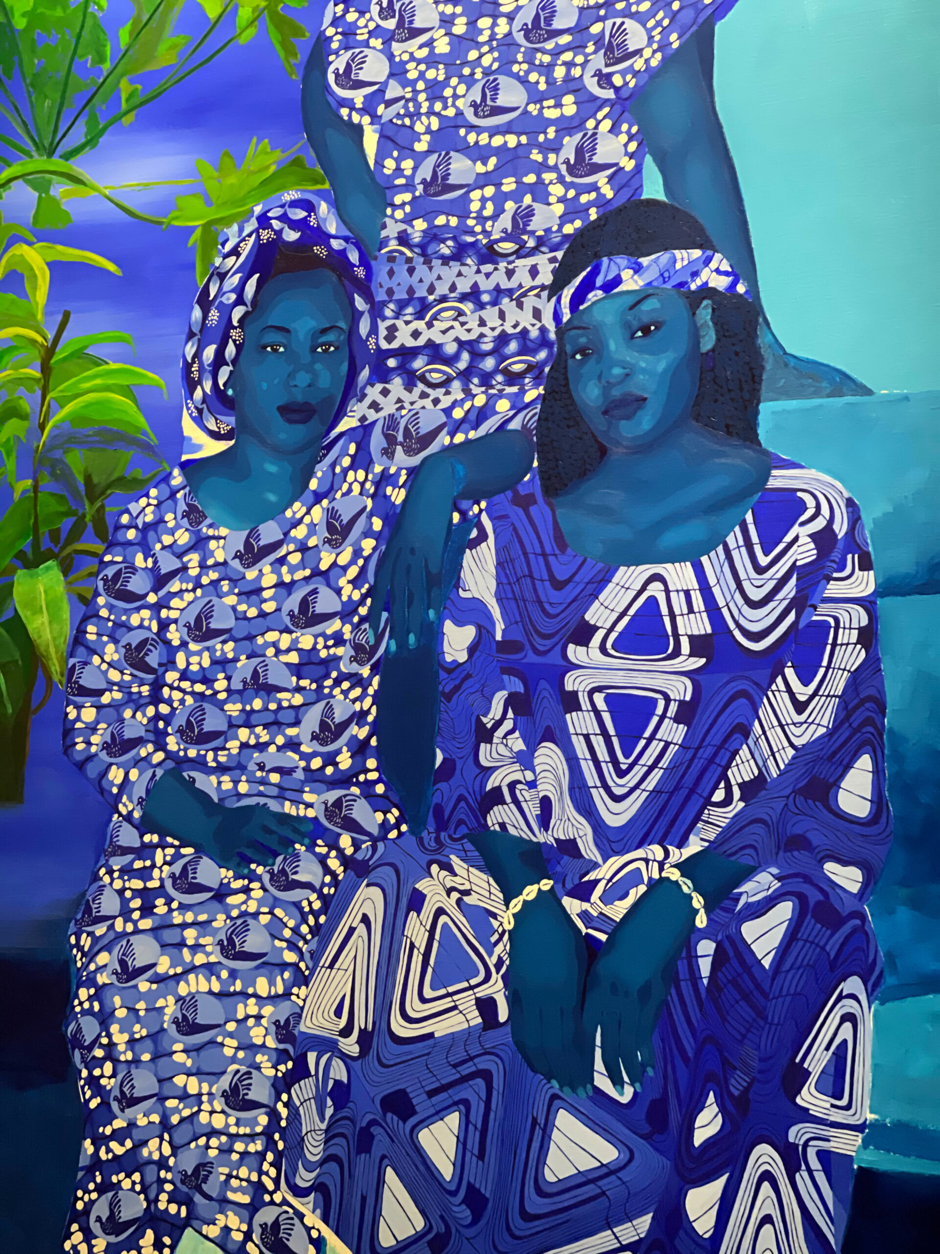 portrait of three women in different shades of blue