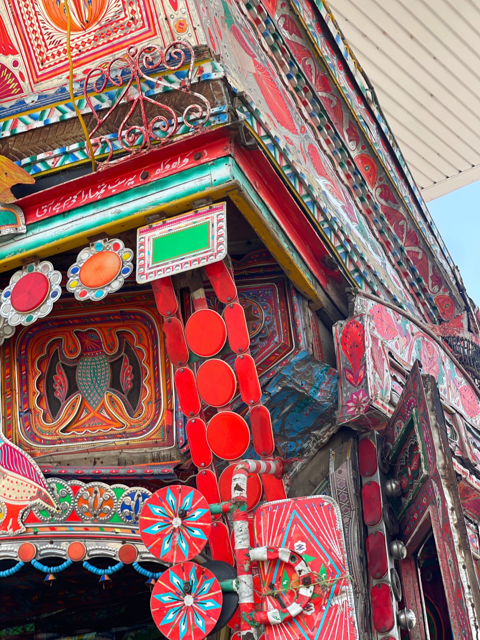 heavily decorated close up of pakistani truck art