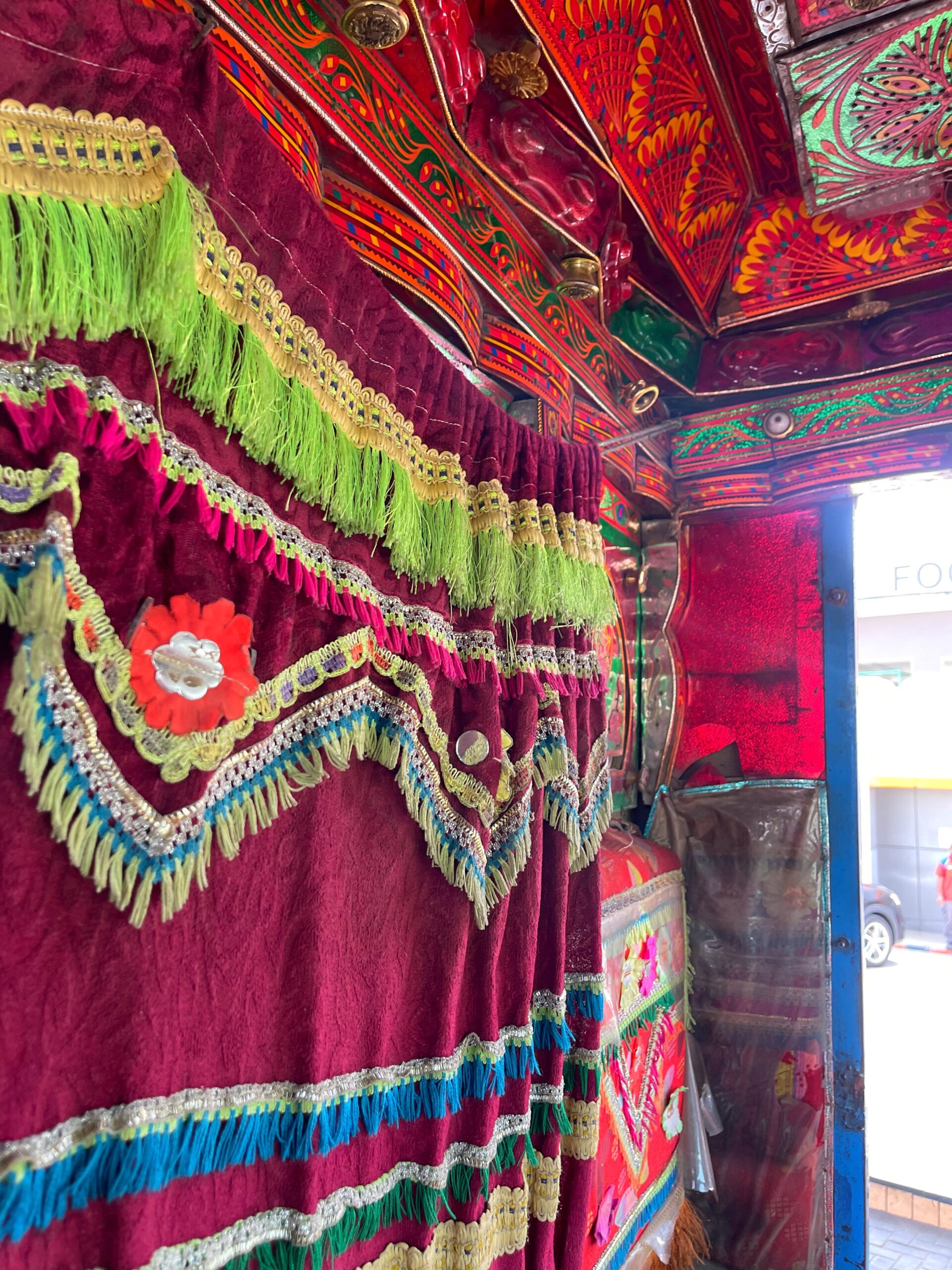 colourful curtains inside pakistani truck art