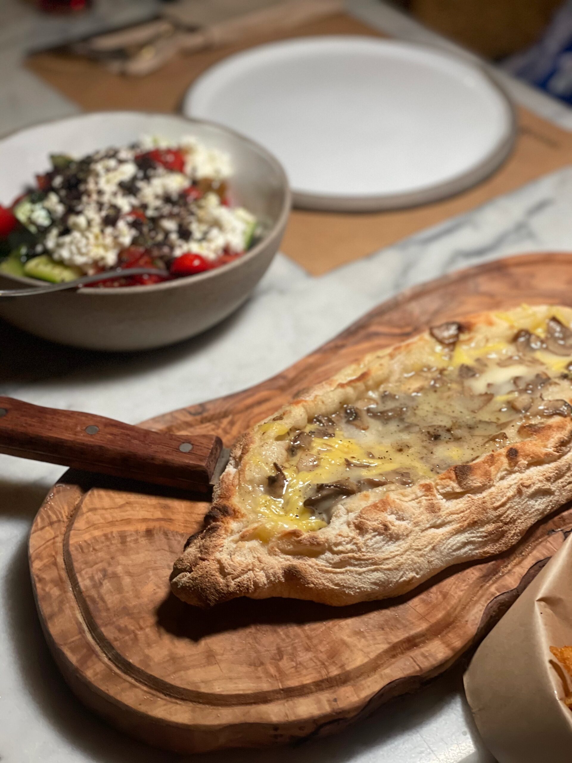 greek pizza boat in restaurant 