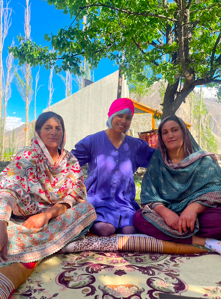 two female cookery teachers dressed in traditional clotehs